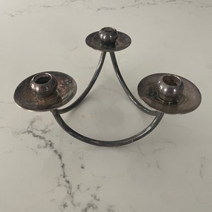 Simplistic Mid Century Modern silver-plated 3 prong candleholder