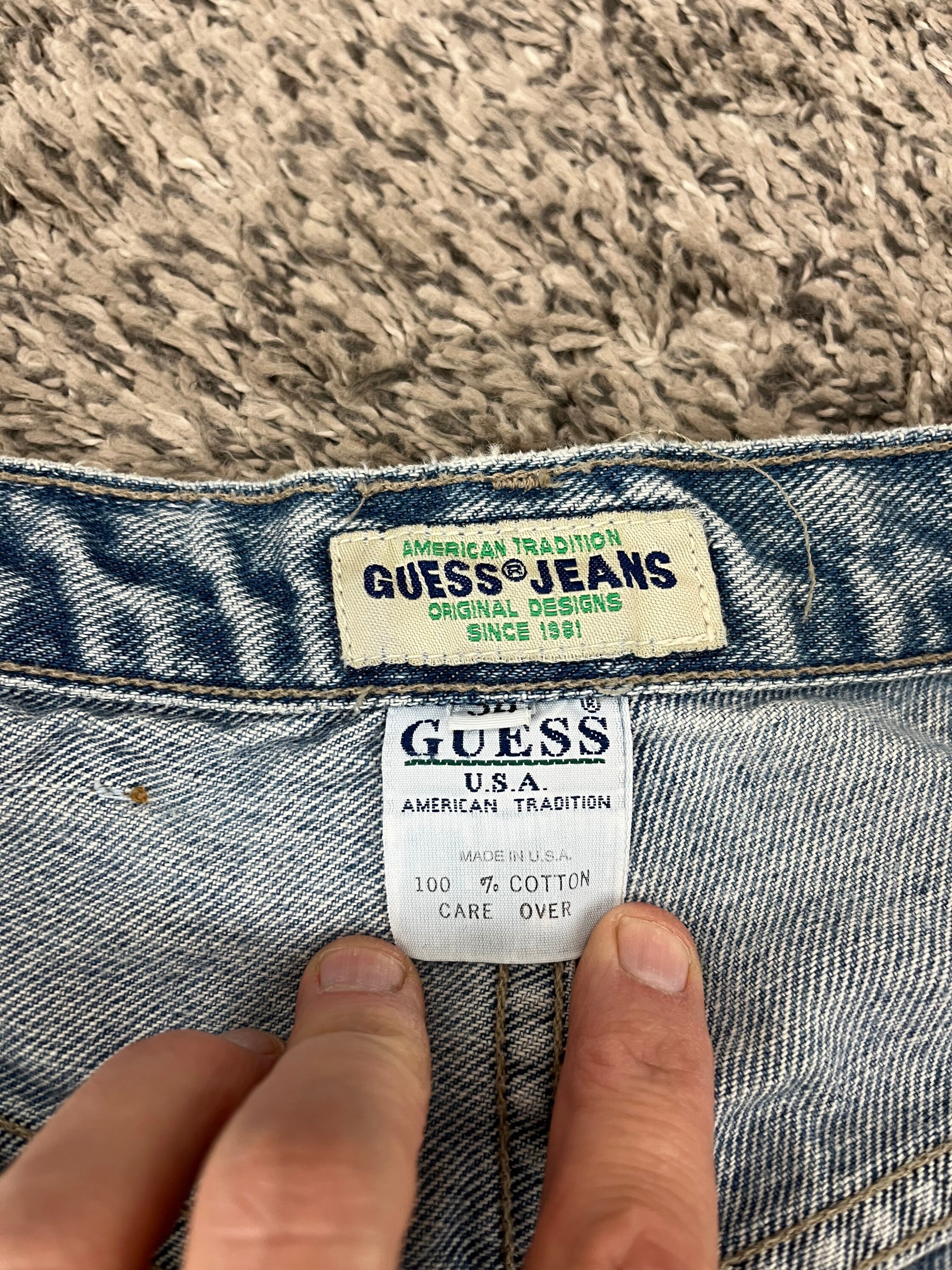 guess triangle jeans