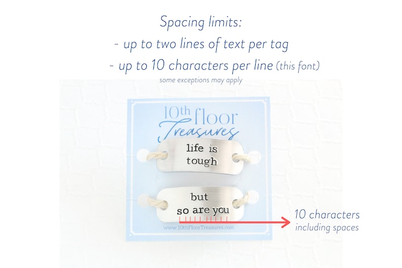Puede incluir: Dos etiquetas met&aacute;licas con las frases "life is tough" y "but so are you" en texto negro. Las etiquetas est&aacute;n unidas a una tarjeta azul claro con el texto "10th Floor Treasures". La imagen tambi&eacute;n incluye l&iacute;mites de espaciado.