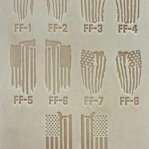 May include: A light tan leather sheet featuring ten laser-engraved designs of American flags combined with firefighter axes. Each design is labeled with text ranging from FF-1 to FF-10, showcasing various artistic interpretations of the flag and axe.