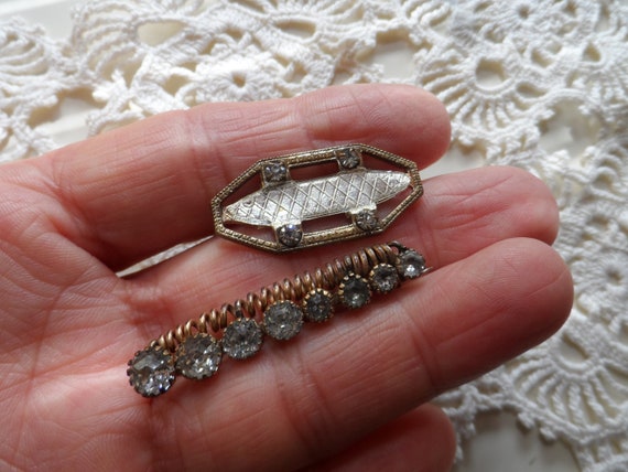 Two sparkly antique bar pins - old, well used, and well loved!