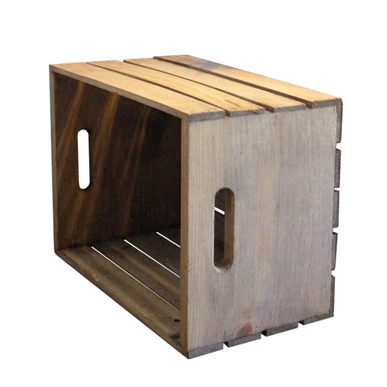 May include: A wooden crate with a rustic brown finish. The crate has two rectangular cutouts on the side and is made of natural wood.