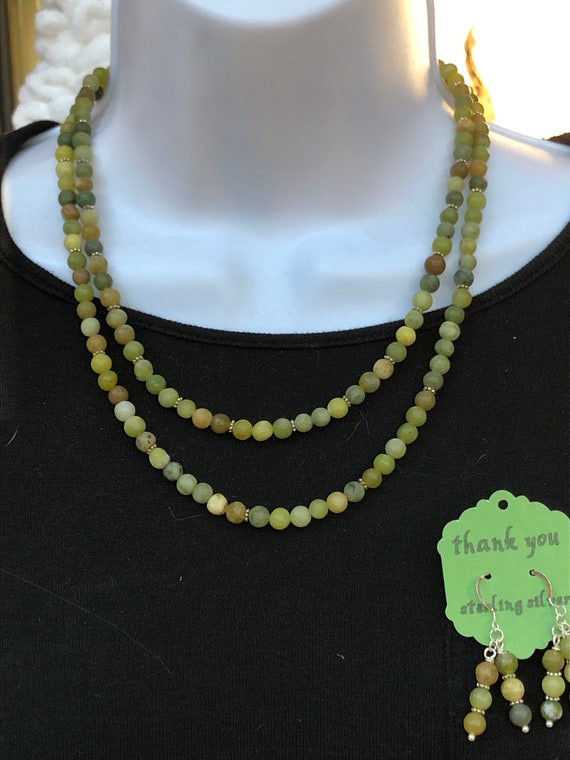 Antique new jade multi chain necklace and earring set.  Round new jade stones and sterling silver ear wires.