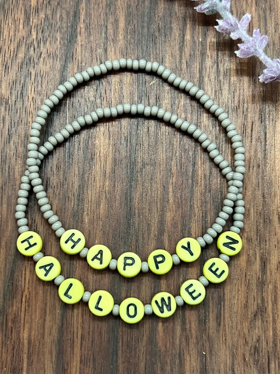 Happy and Halloween stretch bracelets, lime green letter beads with Grey small beads, limited time seasonal bracelets.  Sold together.