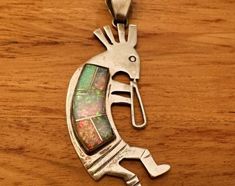 Kokopelli pendant with opal set in Sterling Silver 925. Artist stamped.