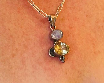 Sterling silver artisan signed rainbow moonstone and citrine pendant.