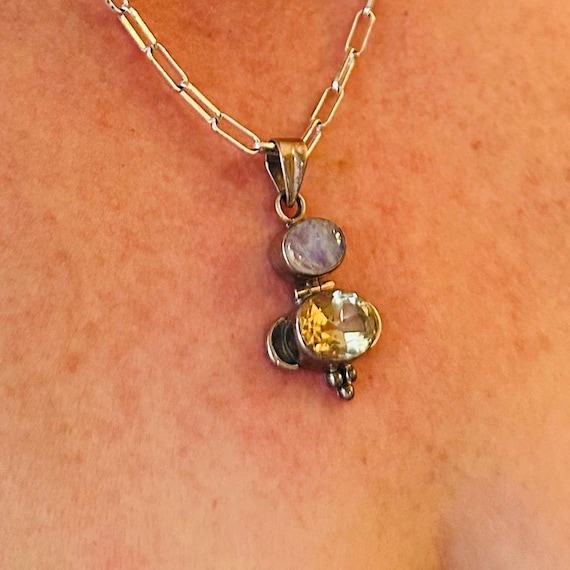 Sterling silver artisan signed rainbow moonstone and citrine pendant.