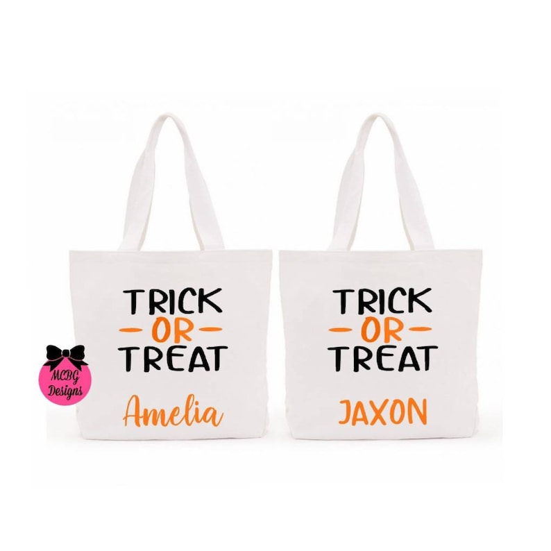 May include: Two white canvas tote bags with black and orange text. The text on the bags reads "Trick or Treat" with a name below. The first bag says "Amelia" and the second bag says "Jaxon".