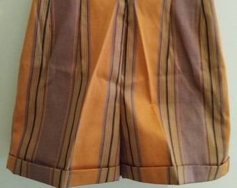 May include: Orange and brown striped shorts with a cuffed hem. The shorts have a waistband with a brown stripe.