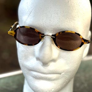 Vintage Y2K Fossil “Cool Shades” Oval Sunglasses w/Tin Case New Vintage Y2K Fossil Stylish Black Unisex | Mercari main image 2