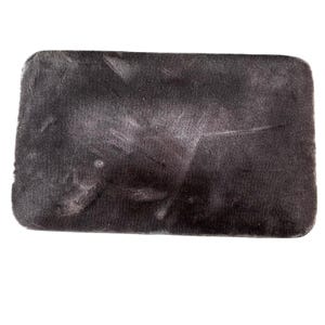 May include: A rectangular, dark gray, textured mat with rounded corners. The mat has a mottled appearance with lighter gray patches, suggesting wear or a unique dye pattern. The surface appears soft and possibly absorbent.