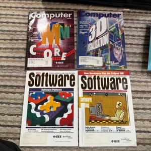 May include: Four computer and software magazines. The top two magazines are titled "Computer" with the first one featuring "ULTI CORE" in large letters. The bottom two magazines are titled "Software".