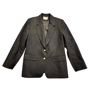 May include: A black blazer with gold-colored buttons and two front pockets. The blazer has a classic design with a notched lapel and long sleeves. The garment is made of a dark fabric.