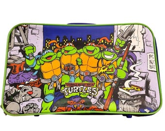 Valigia vintage per bambini delle Tartarughe Ninja (TMNT) del 1991, blu e verde.