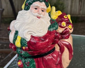 Tarro de cerámica vintage de 33 cm con forma de Papá Noel para galletas, ideal para decorar con guirnaldas de frutas navideñas.