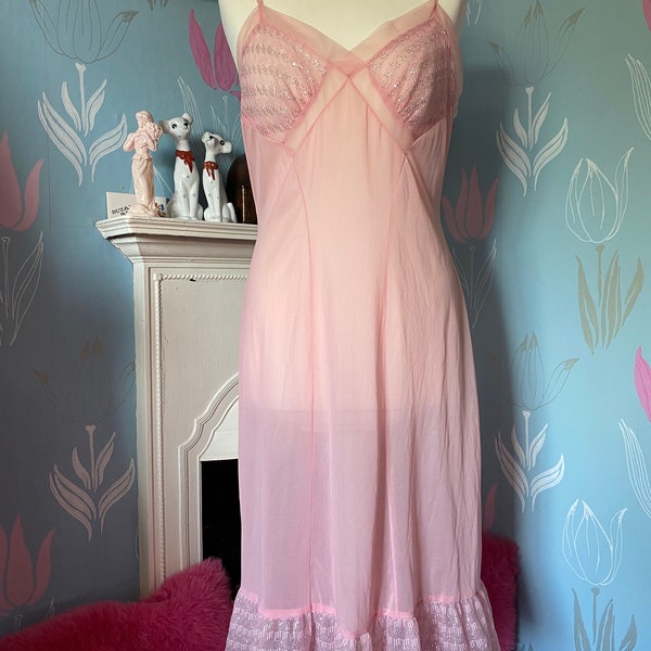 Vintage 1960s, 1970s pale pink with silver lurex nylon full slip, petticoat. Lingerie, lounge wear, underwear.