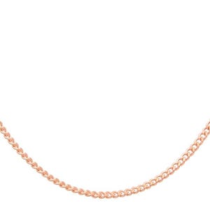 May include: A rose gold curb chain necklace. The chain is made of small, interlocking links, creating a smooth, continuous loop. The necklace is displayed against a white background, highlighting its color and design.