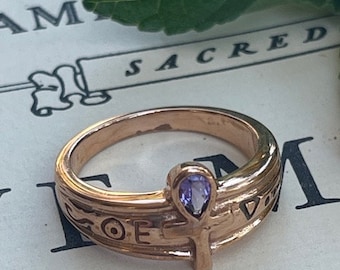 Solid copper Ankh Cross band ring #CTR1878  - 7/16 of an inch wide. Available in sizes 5  thru 10. Very small Genuine Amethyst stone.