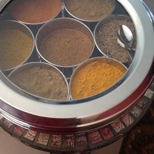 Masala Dabba or Indian Spice Tin with ground spices image 4