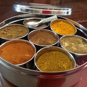 Masala Dabba or Indian Spice Tin with ground spices image 5