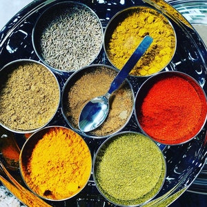 Masala Dabba or Indian Spice Tin with ground spices image 3