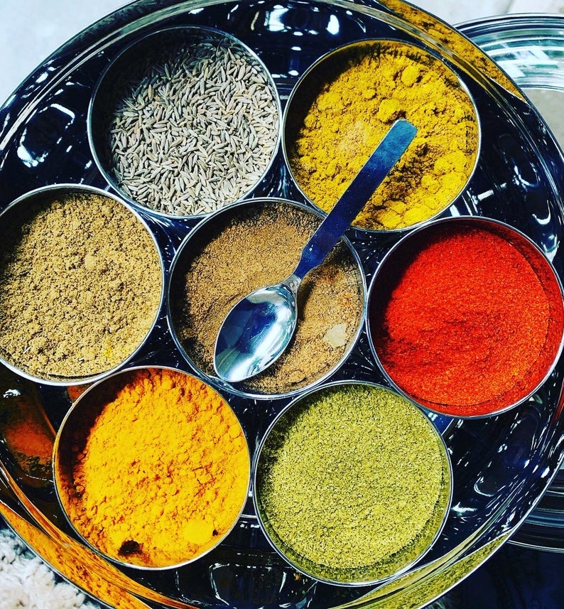 Masala Dabba or Indian Spice Tin with ground spices image 3