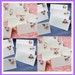 Wedding place name cards. Beautiful floral decoration. Packs of 10. White or Ivory.