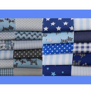 May include: A selection of blue fabric samples featuring diverse patterns. Designs include white stars on navy, polka dots, stripes, dog silhouettes, and gingham checks. The fabrics are stacked, displaying a range of light to dark blue shades.