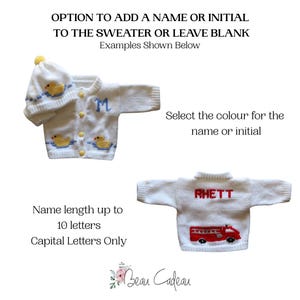 May include: White knit baby sweater and hat set with yellow duck accents. One sweater has a blue "M" initial, the other has "RHETT" in red with a red fire truck. Text: Option to add a name or initial.
