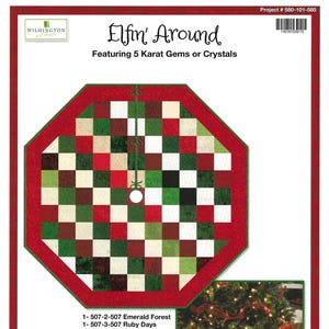May include: A Christmas tree skirt with a red border and a checkered pattern in red, green, cream, and brown. The text "Elfin' Around" and "Featuring 5 Karat Gems or Crystals" are displayed. The skirt is approximately 57.5 inches by 57.5 inches.