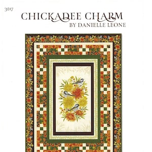 May include: A quilt pattern featuring a floral design with birds. The pattern is called "Chickadee Charm" by Danielle Leone. The quilt is 58 inches by 79 inches.