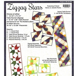 May include: Zigzag Stars quilting pattern featuring a table runner, placemats, and hot pads. The pattern uses a variety of fabrics in shades of red, green, yellow, and purple. The pattern includes instructions for making a table runner, placemats, and hot pads. The pattern is available in a variety of sizes. Project # 580-58-580