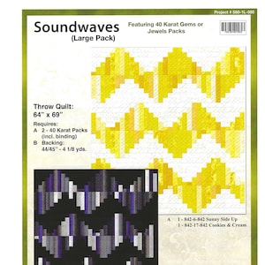 May include: Soundwaves quilt pattern featuring a geometric design with yellow, orange, and white squares. The pattern requires 2-40 karat packs of fabric and 4 1/8 yards of backing fabric. The quilt measures 64 inches by 69 inches.