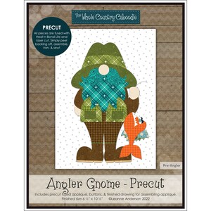 May include: Precut fabric appliqué pattern for an angler gnome with a fish. The pattern includes a finished drawing for assembling the appliqué. The finished size is 6 1/2 inches by 10 1/2 inches.  The pattern is titled "Angler Gnome - Precut" and includes the text "The Whole Country Caboodle" and "@Leanne Anderson 2022".