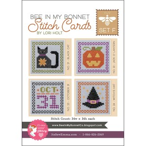 May include: A set of four Halloween-themed cross-stitch cards. The cards feature a black cat, a jack-o'-lantern, the date October 31, and a witch's hat. The text "BEE IN MY BONNET Stitch Cards" is at the top.