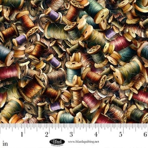 May include: Fabric with a repeating pattern of vintage wooden spools of thread in various colors, including brown, green, purple, and red. The spools are arranged in a dense, overlapping composition, creating a textured and detailed design. The image includes a ruler with measurements in inches.