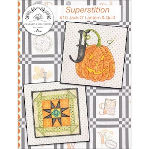 May include: A quilt pattern titled "Superstition" featuring two square designs. One shows a Jack O' Lantern with the letter "J", the other a starburst pattern. The background is a gray and white checkered pattern.