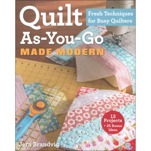 May include: A book cover titled "Quilt As-You-Go Made Modern" with the author's name, Jera Brandvig. The cover features colorful fabric pieces, a rotary cutter, and a sewing machine. The book promises fresh techniques for busy quilters, with 13 projects and 25 bonus ideas.