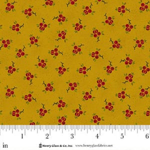 May include: Mustard yellow fabric with a repeating pattern of red berries and green leaves. The fabric has a textured appearance and is measured in inches. The design is suitable for quilting, sewing, or other craft projects.