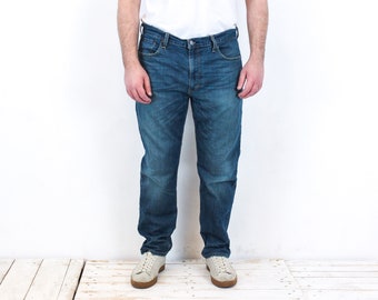 Calça jeans vintage Levi Strauss 502 masculina, tamanho 38 (W38 L32), corte regular, azul, lavagem média, estilo casual, clássica para o dia a dia, fabricada nos EUA (3V).