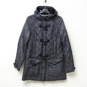 May include: A dark gray quilted jacket with a hood, toggle closures, and two front pockets. The jacket is hanging on a hanger against a white background. The jacket has a diamond pattern.