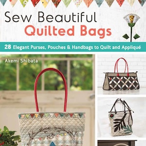 May include: A book titled "Sew Beautiful Quilted Bags" featuring a cover image of a quilted tote bag with a red handle and a design of houses and trees. The book cover also includes a smaller image of a quilted handbag with a brown and white geometric pattern.
