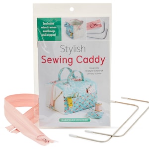 May include: A sewing caddy kit with a blue and white floral print. The kit includes two wire frames, a hoop, and a pink zipper. The kit also includes instructions for making the caddy. "Stylish Sewing Caddy" and "Hardware Included" are printed on the packaging.