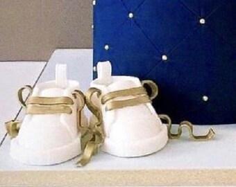 White fondant shoes with gold laces