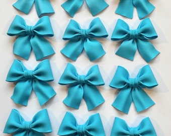 Set of 12 blue bows cupcake toppers.