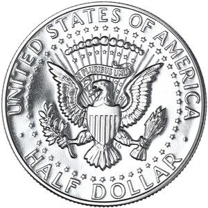 May include: A silver half dollar coin with the words "United States of America" and "Half Dollar" around the edge. The center of the coin features an eagle with a shield on its chest and a banner above it that reads "E Pluribus Unum".