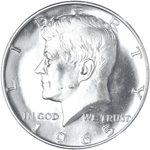 May include: Silver half dollar coin featuring a profile of John F. Kennedy with the inscription "LIBERTY" above and "IN GOD WE TRUST" below. The date "1965" is visible at the bottom.