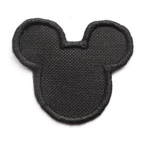 Può includere: Toppa in feltro nero a forma di testa di Topolino.