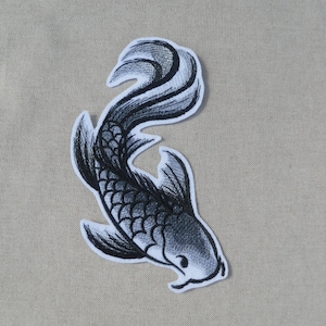 May include: Black and white embroidered iron-on patch of a koi fish with a detailed design.
