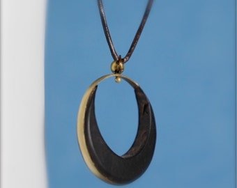 Smile eye pendant in ebony and brass ring (730)